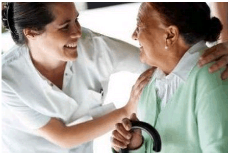 Happy Young Nurse with an Old Patient