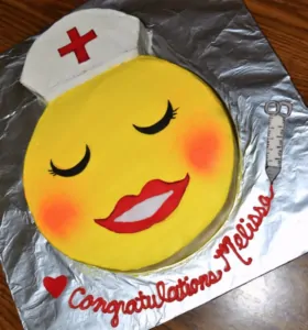 Yellow happy face nurse themed cake