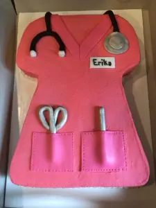 a pink scrub shaped nursing cake
