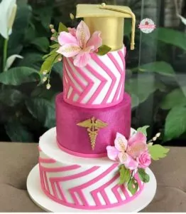 Pink and gold 3-tiered nurse cake with floral accents