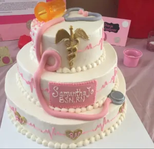 A pretty pink and white nurse cake with 3 tiers